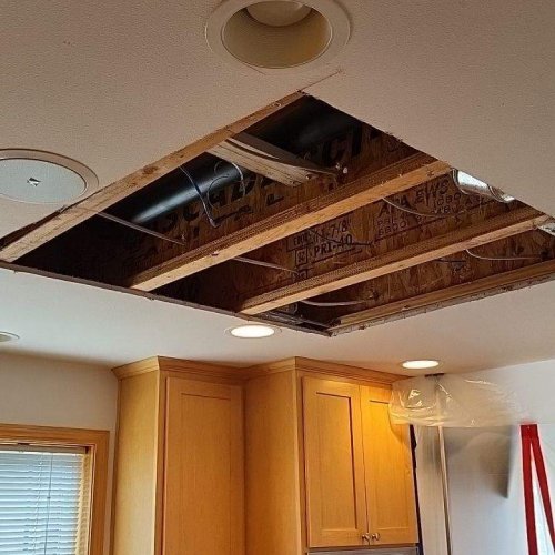 Image of hole in ceiling to attic for cleaning